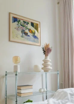 Flowers and a Bowl of Fruit on a Table